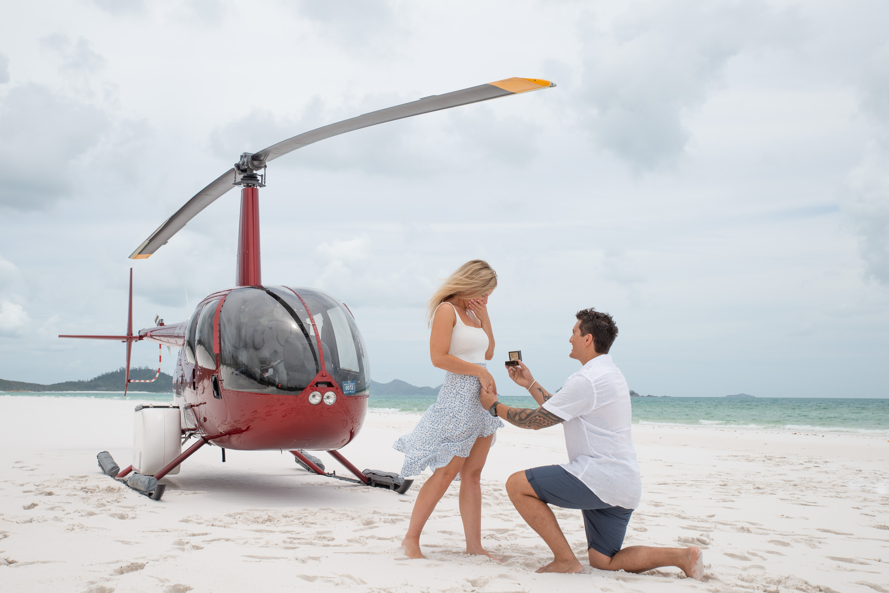 beach proposal idea with a helicopter