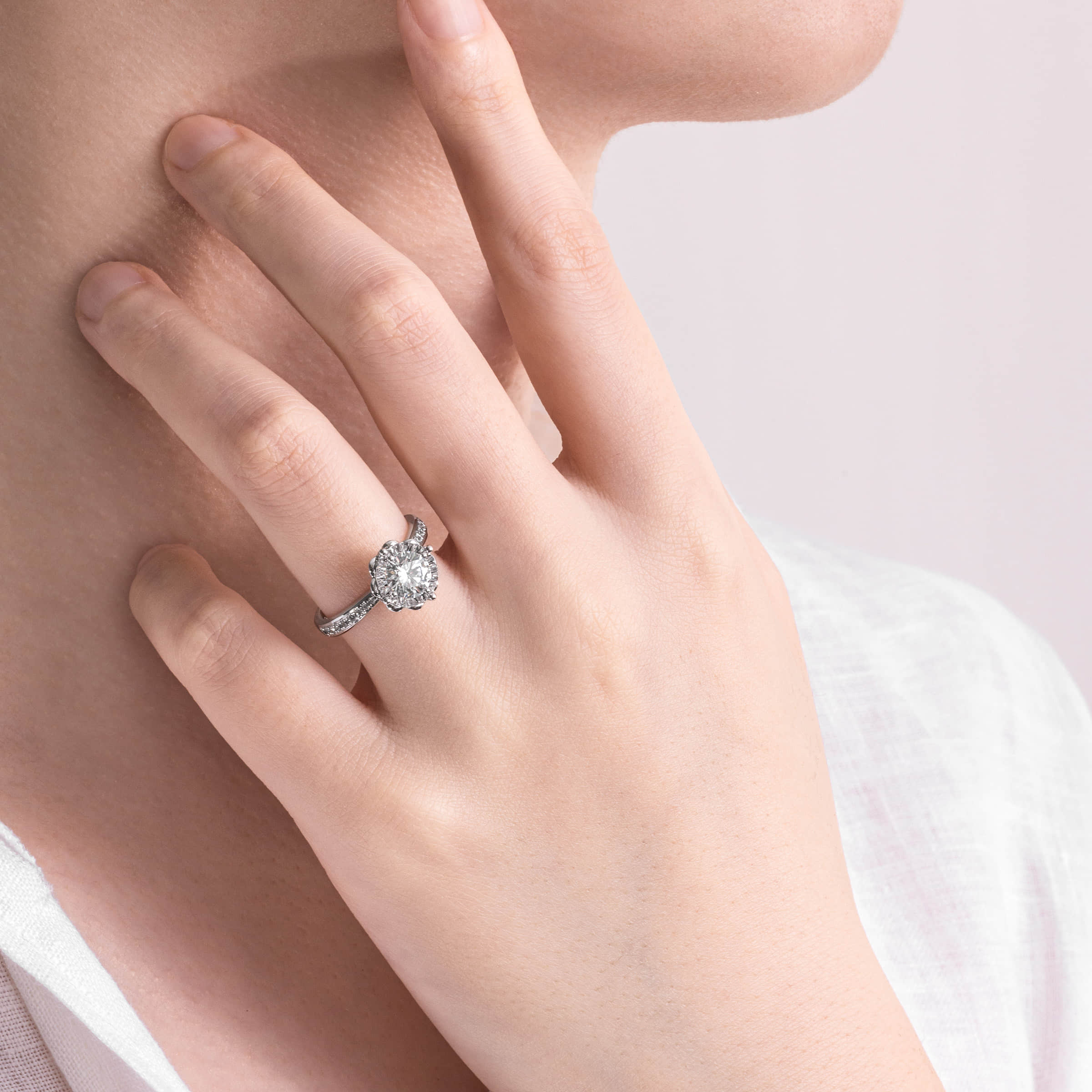 Darry Ring flower shaped engagement ring on finger