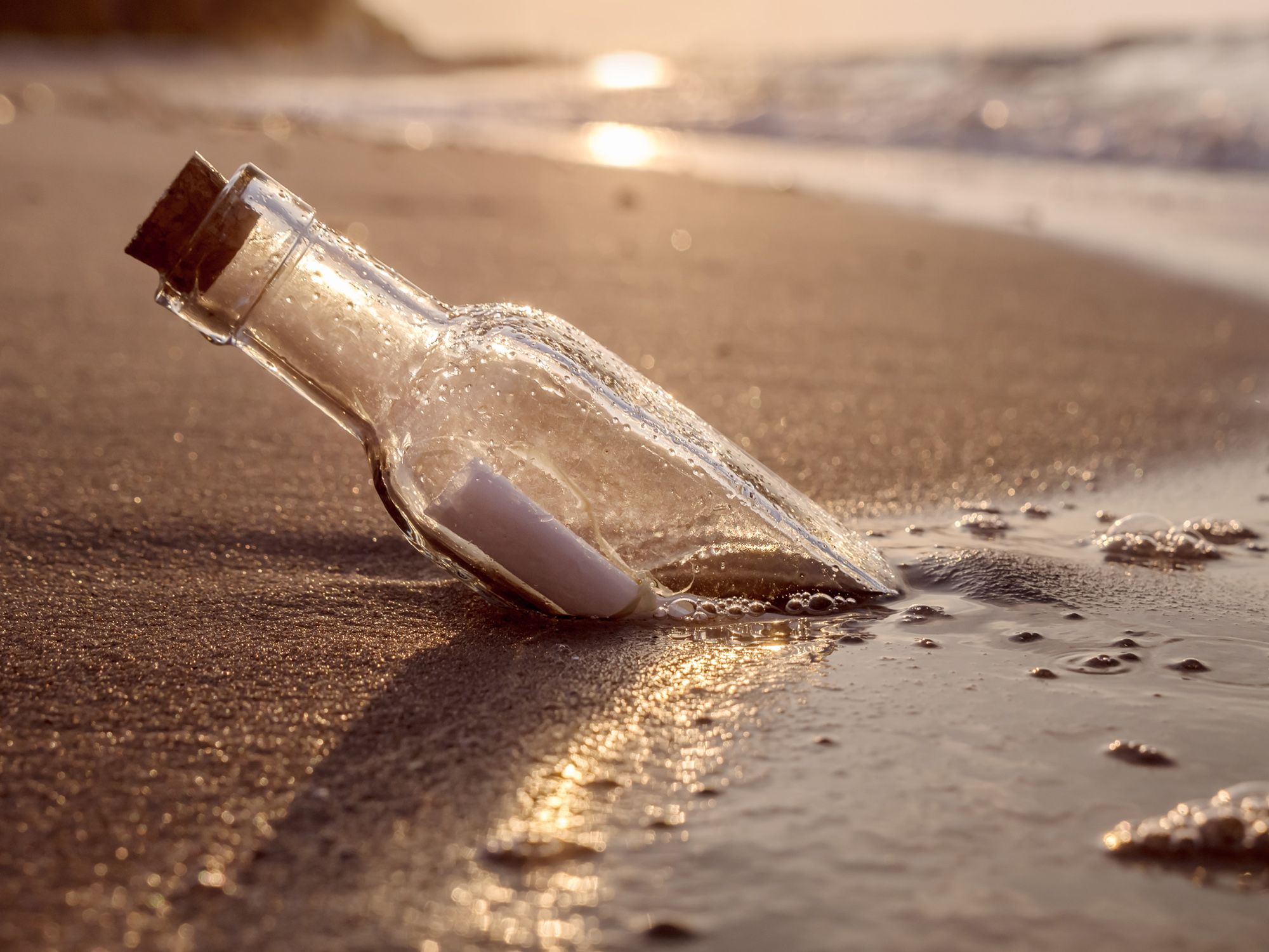 beach proposal - message in a bottle