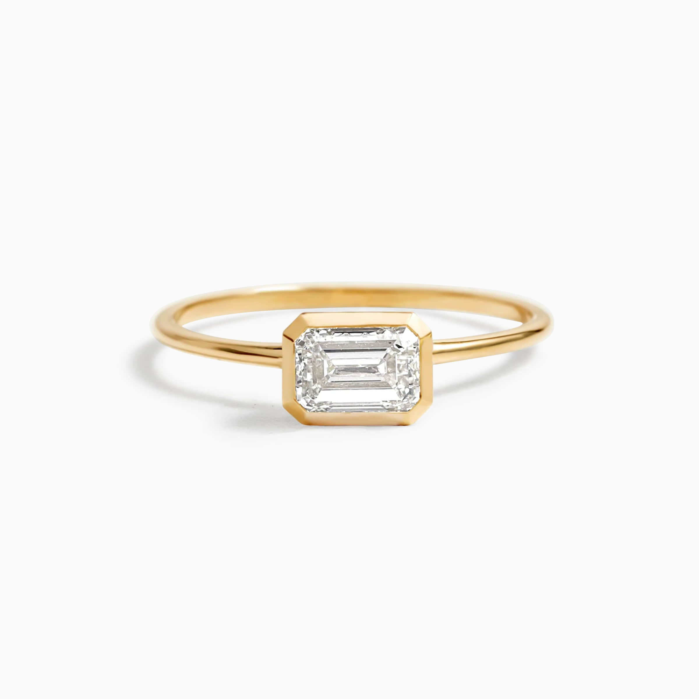 Darry Ring east west emerald cut ring yellow gold