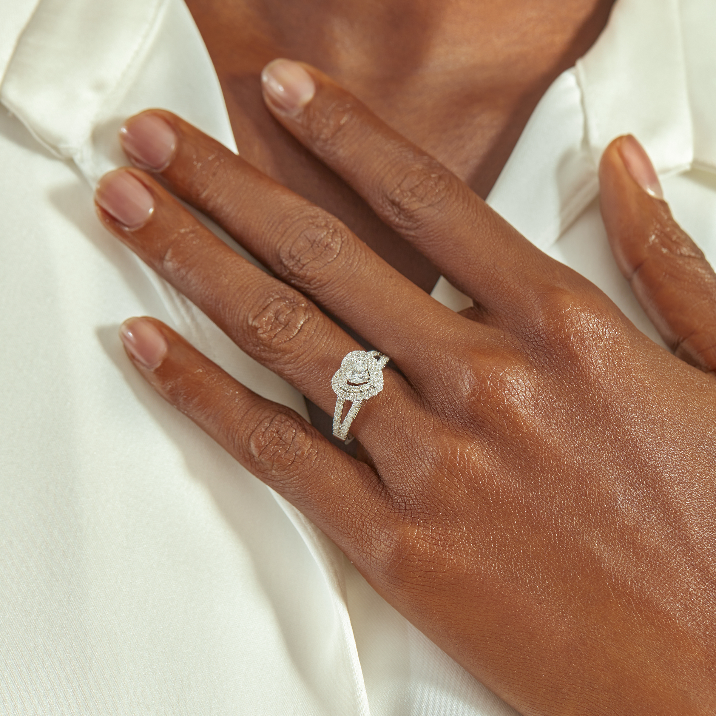 platinum engagement ring on hand